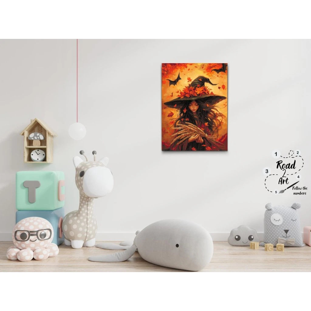 Kvinna i häxhatt med höstlöv – Diamond Painting i varma färger